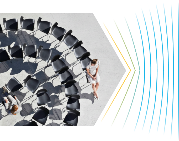 Chairs arranged in a circle with two people seated
